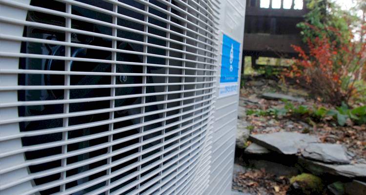 ground source heat pump cost guide &mdash; closeup of a heat pump installation
