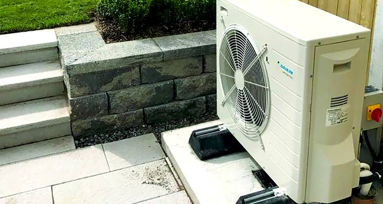 ground source heat pump cost guide &mdash; closeup of a heat pump installation