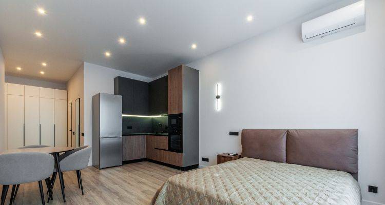spotlights in an open plan bedroom