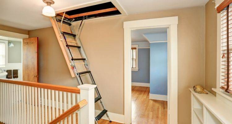 integrated loft ladder installation that leads to an unconverted attic space