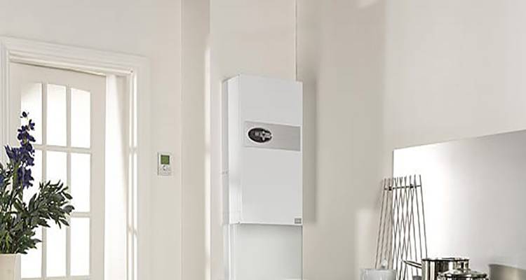 combi boiler installation cost guide &mdash; combi boiler installed on the wall of a kitchen