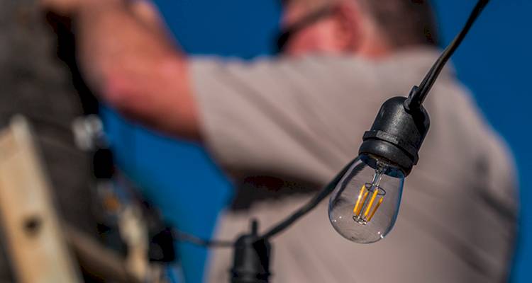electrician installing lights