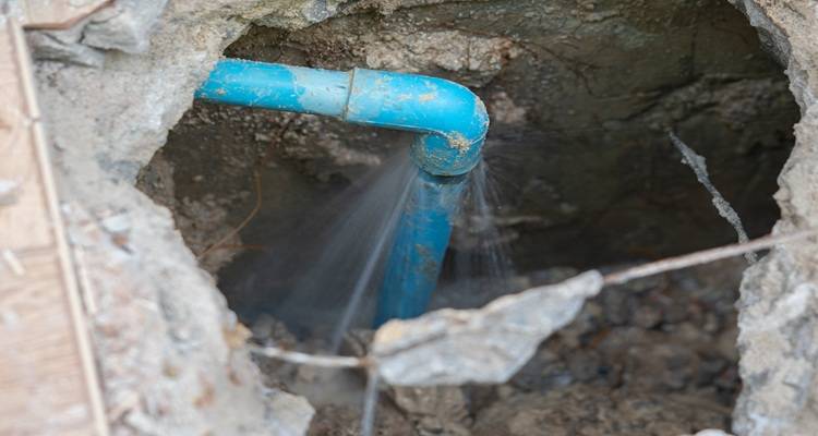 blue underground leaking pipe