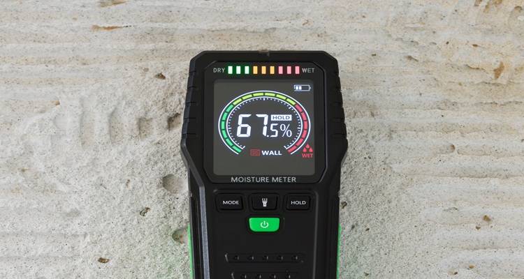 moisture meter on concrete floor