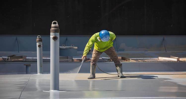 two roof vents man painting