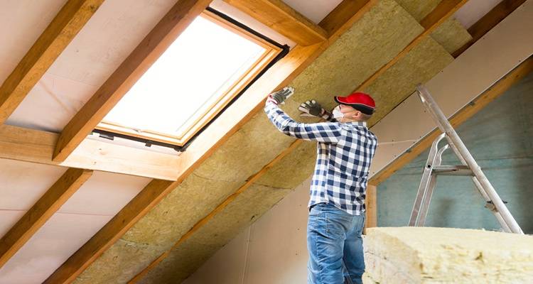 loft insulation being fitted