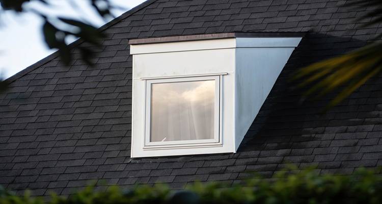 white dormer dark roof