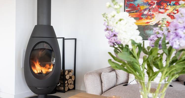 modern log burner flowers foreground
