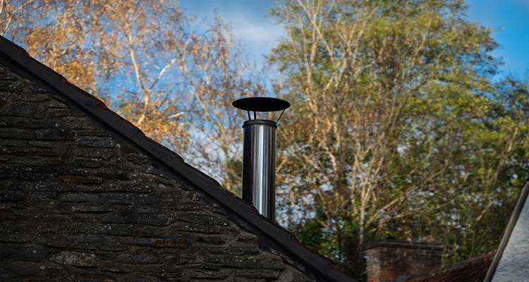 stainless steel log burner flue cottage wall