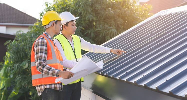 Men looking at roof