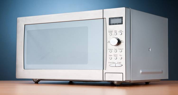 silver microwave blue wall