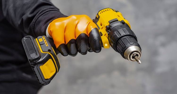 Cordless screwdriver in hand