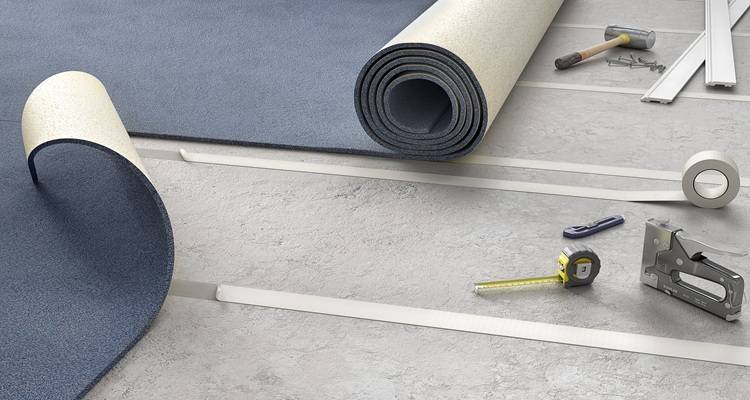 roll of carpet being laid tape