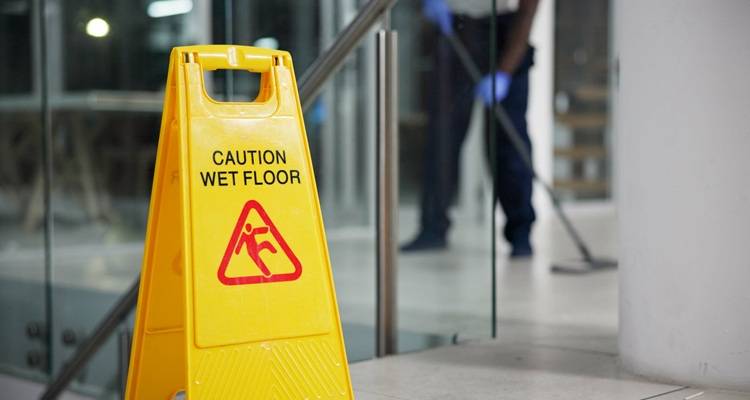 wet floor sign office at night
