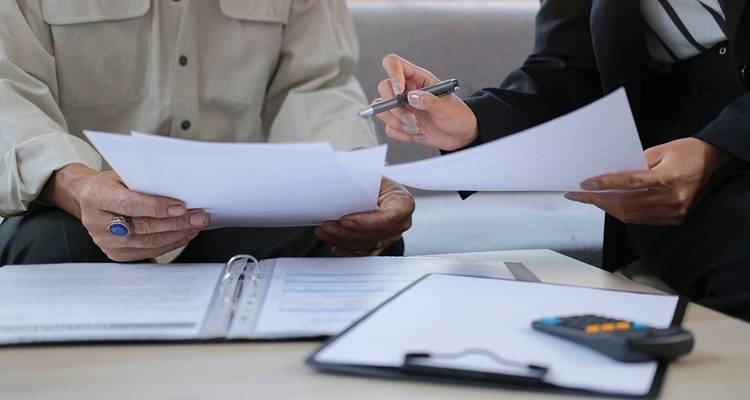 people looking at paperwork