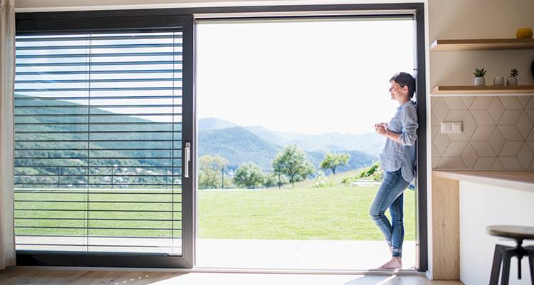 woman standing in an open sliding door