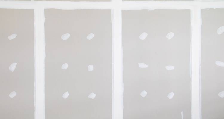 sheets of plasterboard on wall
