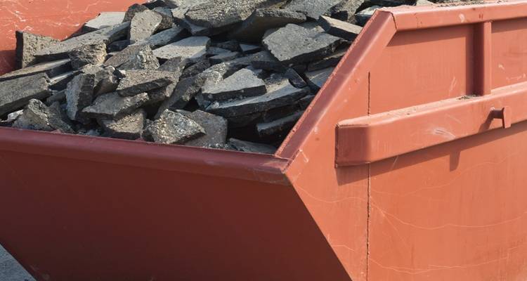 red skip full of concrete