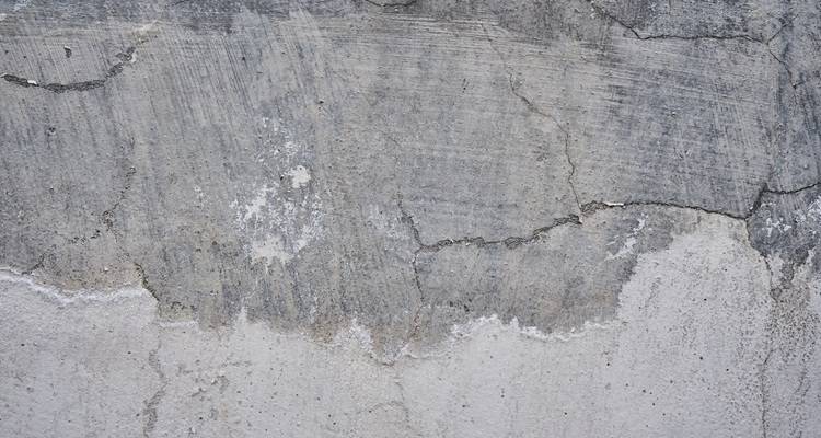 grey wall with cracks