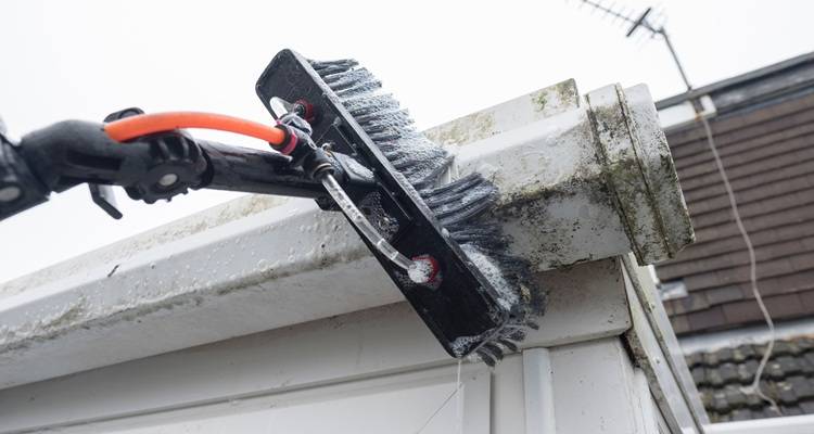 Gutters being cleaned