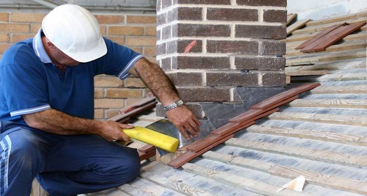 man repairing flashing