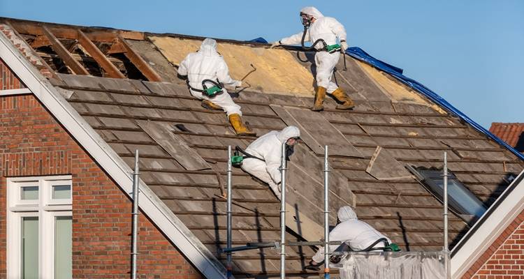 roofers removing roof tiles