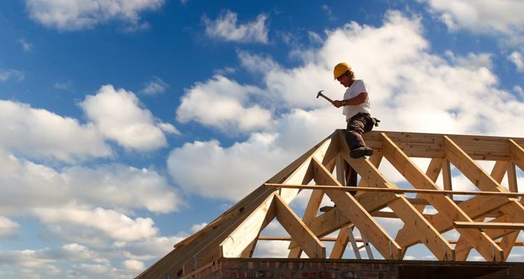 roofer installing roof tiles