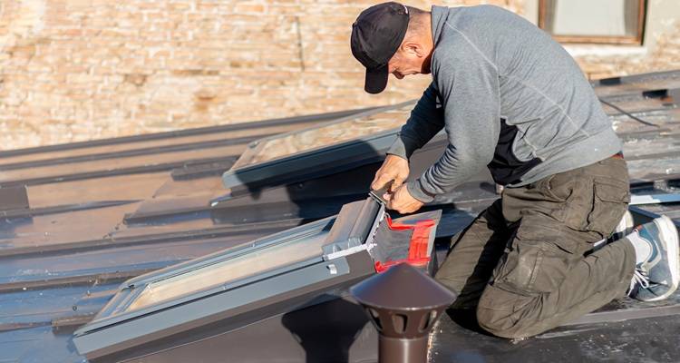 roofer installing roof tiles