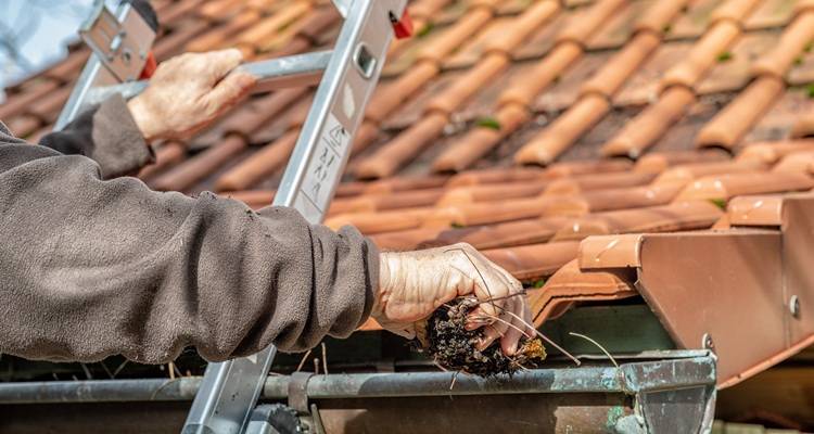 roofer installing roof tiles