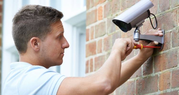 person who is installing cctv camera