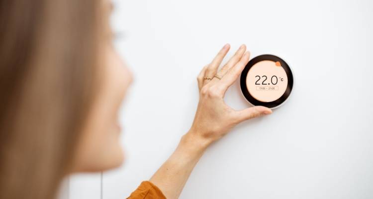 person adjusting a smart meter