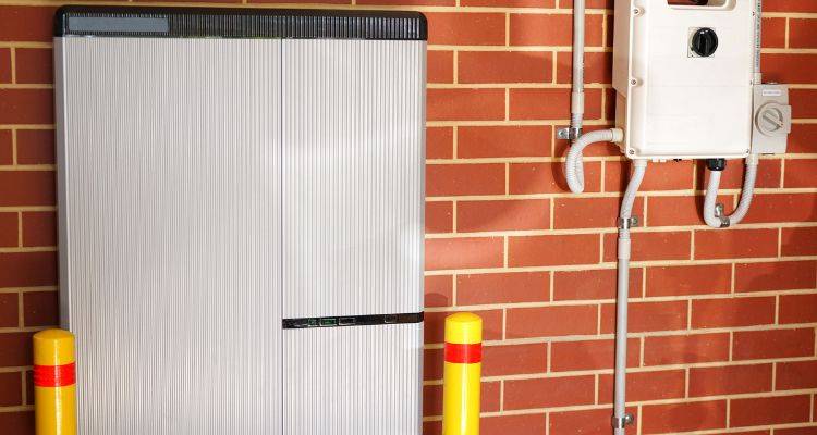 solar battery installed on a brick wall in a garage