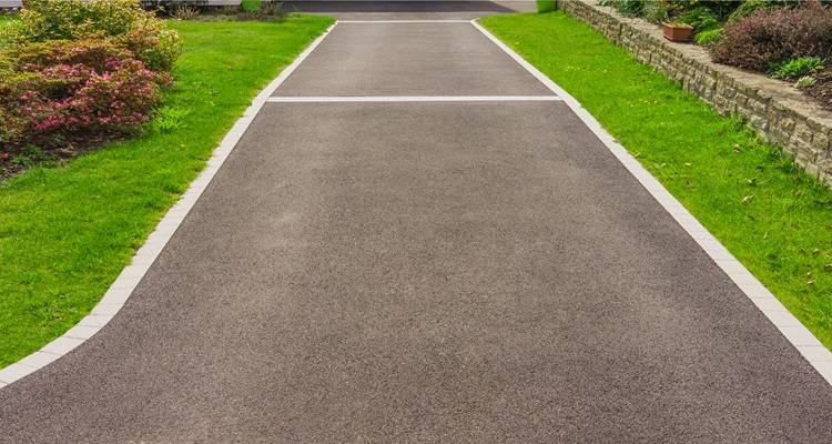 tarmac drive green grass