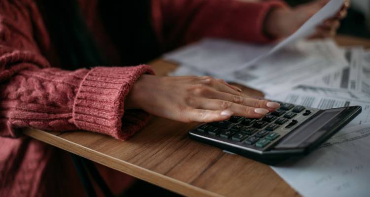 person with calulator