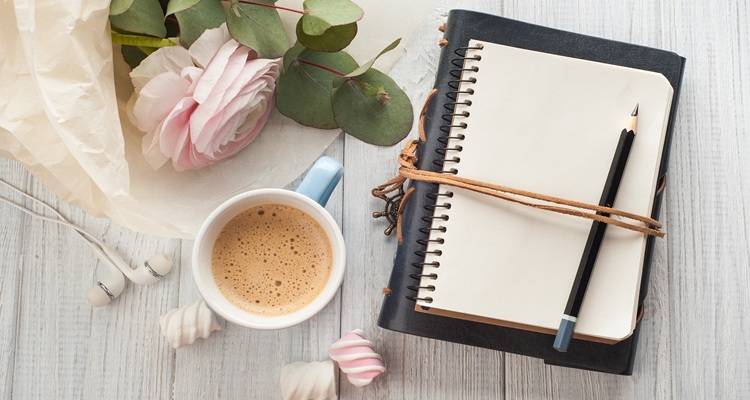 notepad and cup of tea