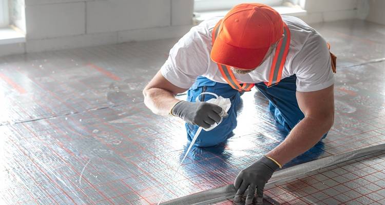 man insulating floor