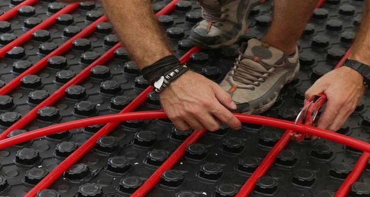 red underfloor heating pipes black floor