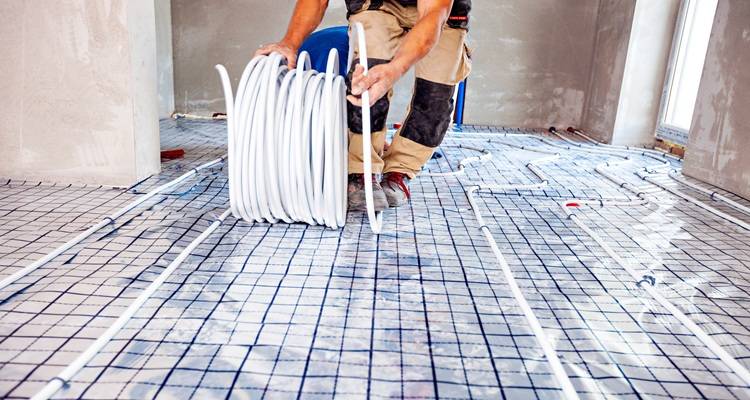 roll of underfloor heating on floor