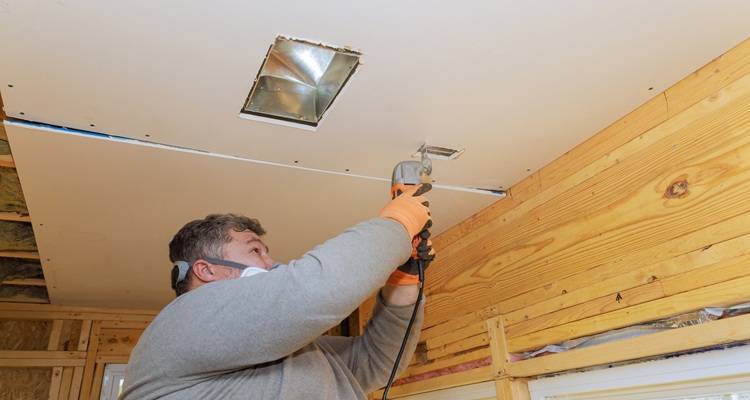 Man fitting lighting