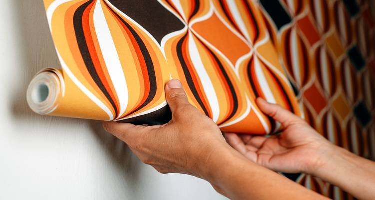 mid-century wallpaper being hung