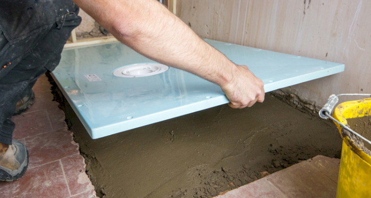 tradesperson in the process of installing a wetroom in the UK