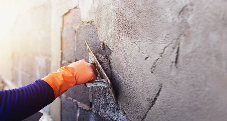 plaster repair trowel orange glove