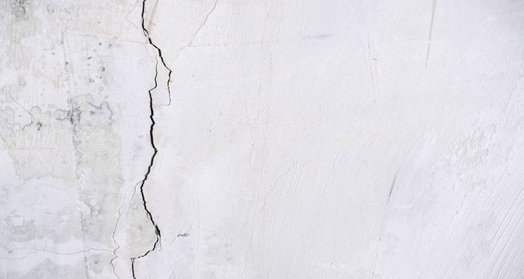 big vertical crack white wall