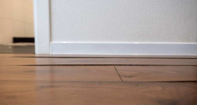 dark laminate flooring lifting doorway