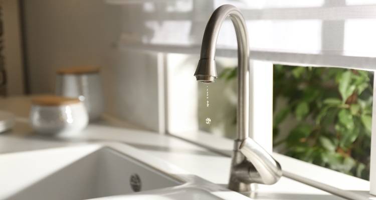 kitchen tap leaking blurred background